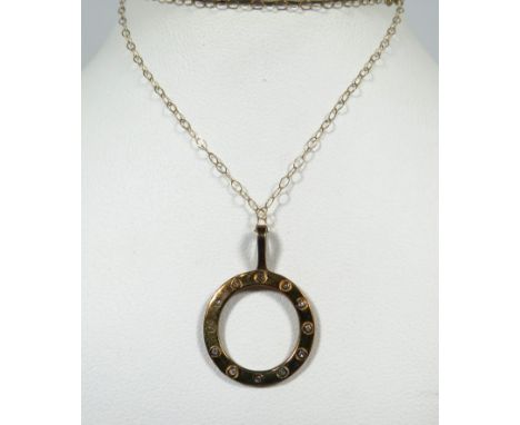 9ct Yellow Gold Circular 'Porthole' Pendant set with 12 Tiny Diamonds hung upon a 16 inch 9ct Yellow gold Chain. Total weight