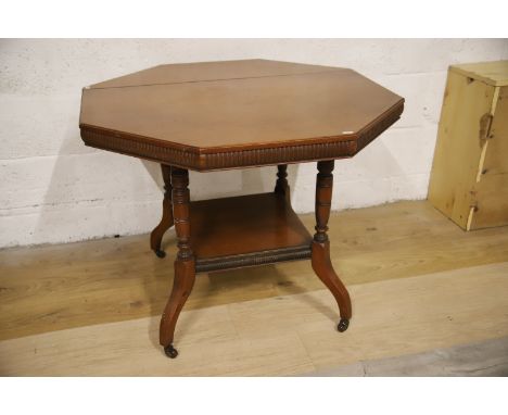 Edwardian Era Octagonal topped table with stretcher shelf under.  Expansion split to top. Oak construction. See photos. 