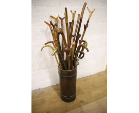 Large selection of Walking sticks, canes and staffs all of Rural theme together with a cylindrical Stick Stand. See photos.