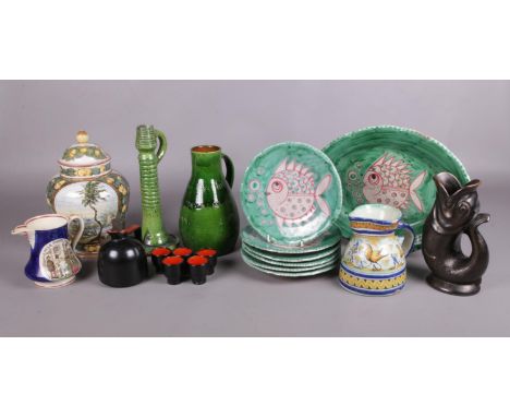 A selection of hand-made pottery. To include a Burmantofts style candlestick, Royal Winton Gurgling fish jug, a Baron Barnsta