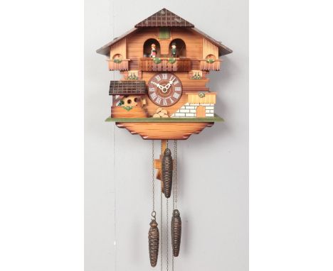 A German black forest cuckoo clock. (Der Froehliche Wanderer Edelweiss No 2708) 30cm height, weights &amp; pendulum.  