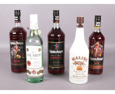 Five sealed bottles of rum. Includes Bacardi, Captain Morgan and Malibu.  