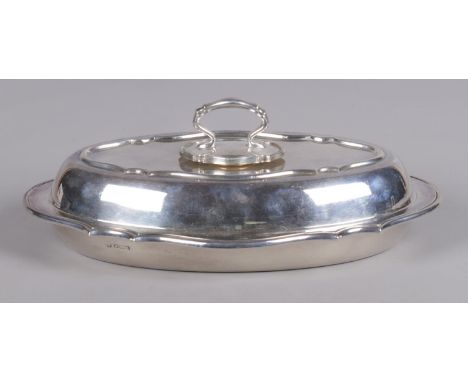 A George V silver tureen and cover. Assayed Sheffield 1917 by William Hutton &amp; Sons Ltd. Retailers mark to base for John 