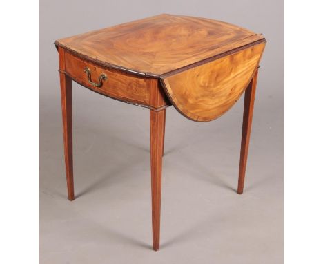 A George III satinwood Pembroke games table. Crossbanded in mahogany, with strung inlay and raised on square tapering support