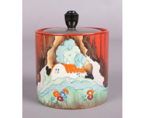 A Clarice Cliff preserve pot with metal lid decorated in the Cottage Glen design. Marked Wilkinson LTD to the base. (10cm tal