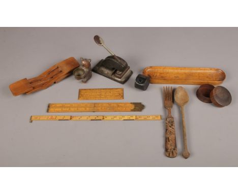 A selection of collectables. To include a carved wooden bear, Rabone hinged ruler, a carved wooden fork and a paper embossing