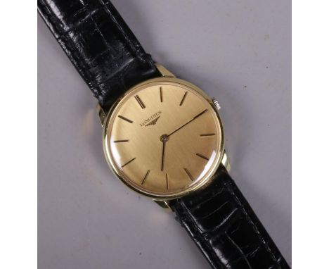 A gents Longines manual wristwatch. With baton markers and champagne dial. In box.  Running.