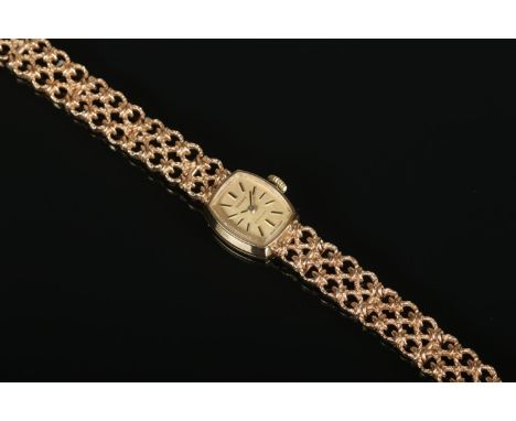 A ladies 9ct gold Tissot 'Stylist' manual wind wristwatch, with face and clasp both stamped 375. In working order. 19g gross 