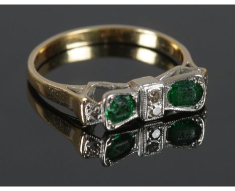 An 18ct gold and Platinum green stone and diamond 'bow' ring. Size M½. Total weight: 3.13g.  