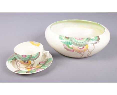 A Clarice Cliff Rhodanthe bowl, along with a cup and saucer in the same design. Both from the Bizarre range, Wilkinson Ltd. B