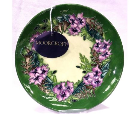 Moorcroft green ground floral plate, D: 22 cm. No cracks, chips or visible restoration. P&amp;P Group 1 (£14+VAT for the firs