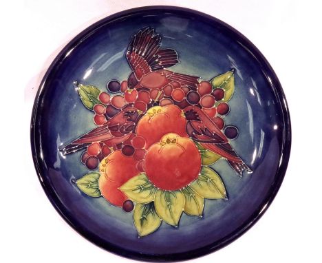 Moorcroft blue ground plate in the Fruit and Finches pattern, D: 26 cm. Age related crazing but no cracks, chips or visible r