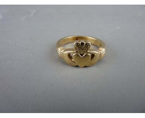 AN UNMARKED GOLD LOVE RING, 8.2 grms