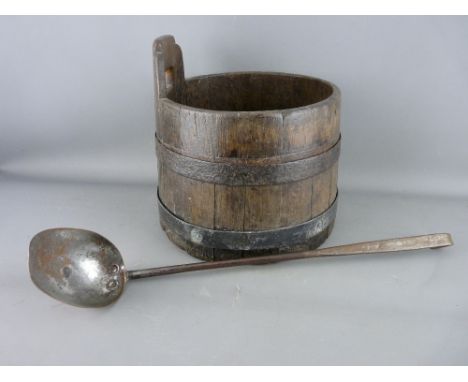 AN ANTIQUE COOPERED PIGGIN (DIPPING VESSEL) with stave handle and an early iron handled ladle with beaten copper bowl