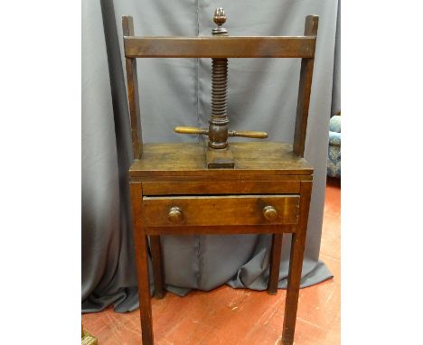 AN ANTIQUE MAHOGANY BOOK PRESS, a single frieze drawer with turned wooden knobs, the whole raised on block supports, the thre