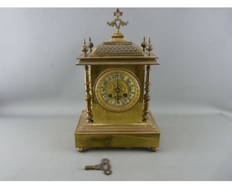 A 19th CENTURY FRENCH LACQUERED BRASS MANTEL CLOCK having gilt pierced dial detail and Arabic numerals, before an Ad Mougin m