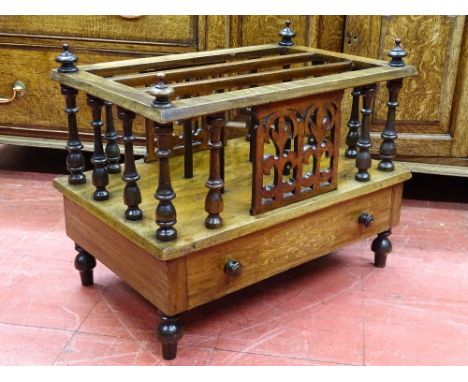 A VICTORIAN WALNUT THREE SECTION CANTERBURY having a single base drawer with inlay detail, spindle gallery sides and finial c