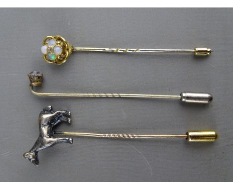 THREE VINTAGE STICK PINS including a silver/white metal horse with diamond eye, a possibly gold knot with opal cluster and sa