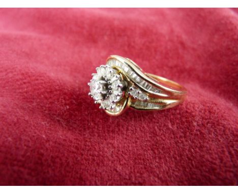 A FOURTEEN CARAT GOLD DRESS RING with central 0.5 carat diamond (from J C Penny), 7.5 grms, size 'P/Q'