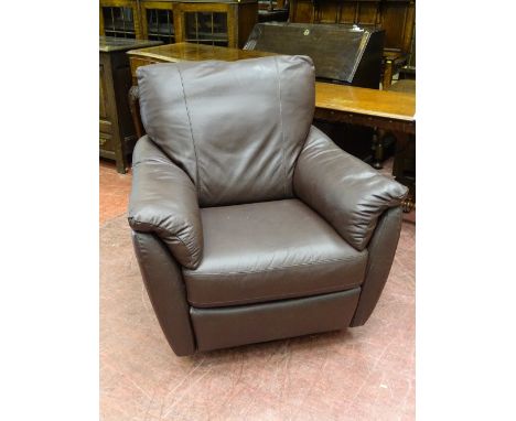 A MODERN SOFT FEEL BROWN LEATHER EFFECT MANUAL RECLINER ARMCHAIR on a swivel and rocking base, 97 cms high, 96 cms wide, 54 c