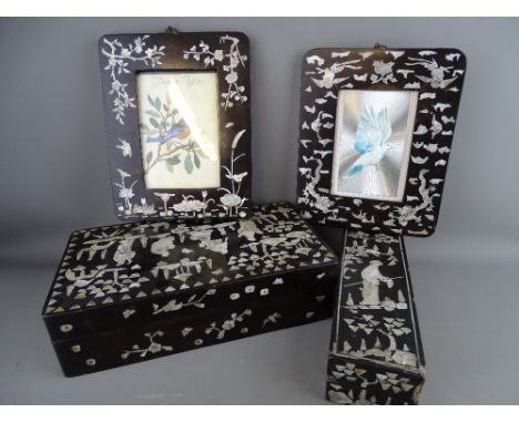 TWO ORIENTAL MOTHER OF PEARL INLAID &amp; LACQUER WORK BOXES and two hanging portrait frames, various measurements