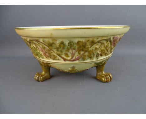 A ROYAL WORCESTER BLUSH IVORY &amp; GILT DECORATED THREE FOOTED BOWL, 8.5 cms high, 17.5 cms diameter