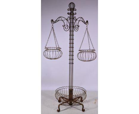 Wrought iron flower basket stand, central column supporting two branches, circular base, 210cm, together with another basket 