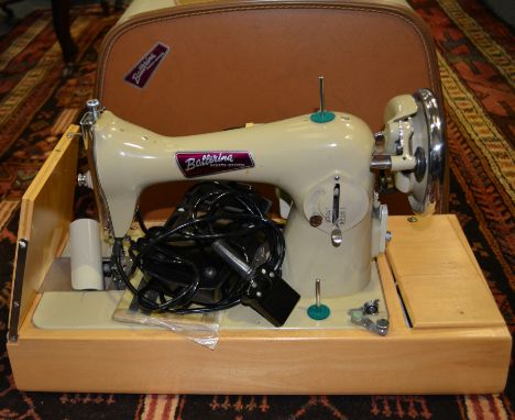 Ballerina multi stitched sewing machine, cased and an Olivetti Studio 46 typewriter in a hard plastic case (3). 