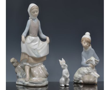 Lladro figure of a girl with a hen, 26cm, three other Lladro figures, Nao figure and a Lladro booklet.