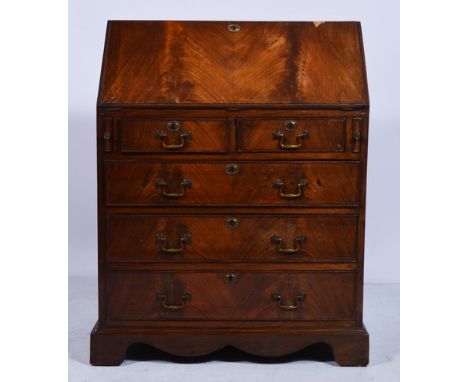 Mahogany bureau, fall front enclosing a part fitted interior, two short and three long drawers below on bracket feet, width 7