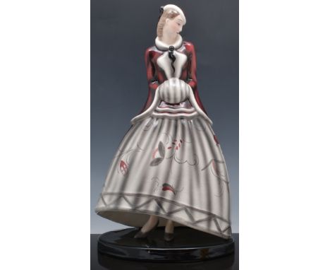 Goldscheider pottery figure, of a Lady in a Winter Coat, impressed 6507 52 6, repaired, 35cm.