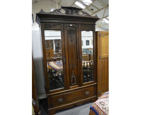 Late Victorian walnut double wardrobe, shaped pediment, moulded cornice with two mirror panel doors, flanked by a panel, Art 