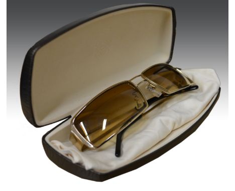 A boxed Patek Philippe silk scarf, tiger print 2003 and a pair of Loewe sunglasses in case, with box.