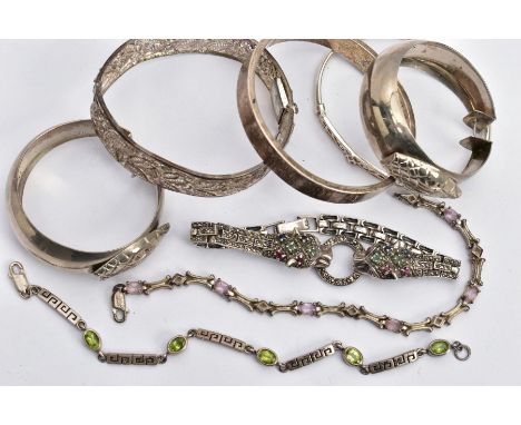 SIX BRACELETS AND A PAIR OF HOOP EARRINGS, to include a silver double jaguar head bracelet set with low quality rubies, sapph