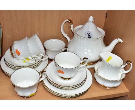 A ROYAL ALBERT VAL D'OR PART TEA SET, comprising five teacups - one chipped, six saucers and side plates, milk jug, open suga