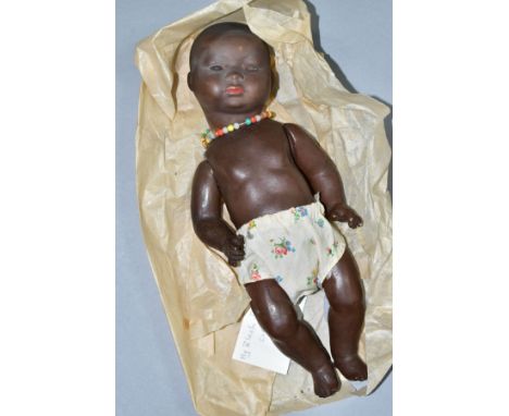 A GERMAN KB-M 1 BLACK BISQUE HEAD DOLL, composite body and bent limbs, sleeping eyes, pierced ears, painted hair, eyelashes a