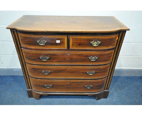 A REGENCY MAHOGANY AND SATINWOOD CROSSBANDED BOWFRONT CHEST OF TWO SHORT AND THREE LONG DRAWERS, flanked by flat columns, on 