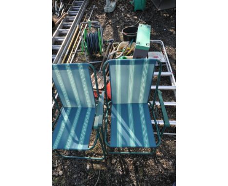 A SELECTION OF GARDEN MICELLANEOUS, to include a hose reel, various hand tools, two garden kneeling/stool, watering cans, two