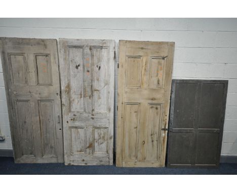 THREE VINTAGE PANELLED PINE INTERIOR DOORS, all roughly 83cm x 204cm and another panelled cupboard door (4)