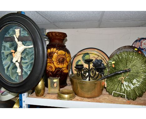 A GROUP OF CERAMICS, GLASS AND METAL WARES, to include a crucifix in a black oval glazed frame on a green fabric background (