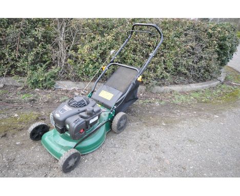 A KINGFISHER INTERNATIONAL PETROL LAWN MOWER with a Briggs and Statton 450e 125cc engine and grass box (engine pulls and star