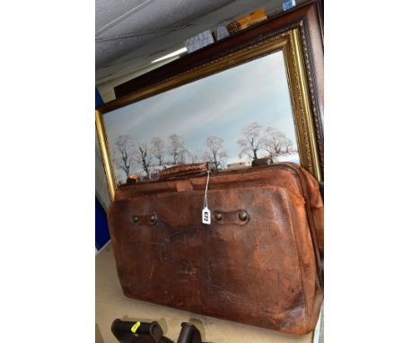 AN EARLY 20TH CENTURY BROWN LEATHER BAG, EMBOSSED INITIALS W.E.B., the interior with checked fabric interior with central div
