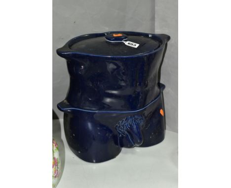 A FLESH POTS SET OF TWO STACKING CERAMIC CASSEROLES/VEGETABLE DISHES, in the form of a male torso, dark blue glaze, total hei