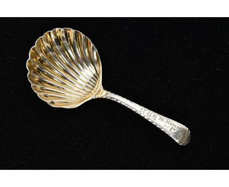 A SILVER COLOURED METAL CADDY SPOON, engraved M.G.B in memory of C.G to the front of the handle, partial mark to the back of 