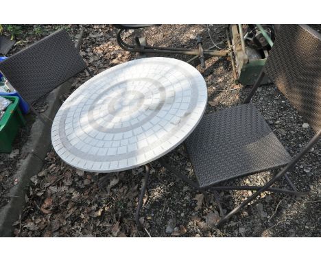 A CIRCULAR TILE TOP PATIO TABLE, diameter 70cm x height 70cm and two rattan effect folding chairs (3)