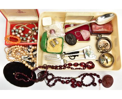 A BOX OF ASSORTED ITEMS, to include a white metal citrine set cross pendant, a carved ivory book pendant set with mother of p