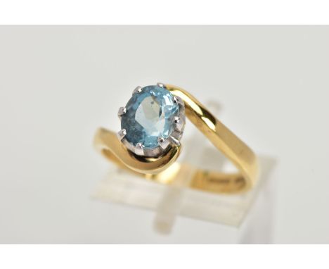 AN 18CT GOLD AQUAMARINE RING, an oval cut aquamarine, approximate dimensions length 8mm x width 6mm, set in an eight prong wh