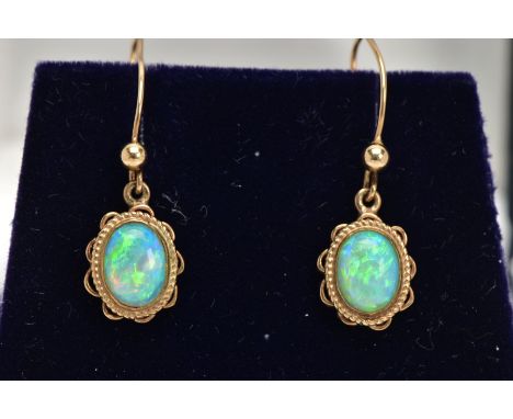 A PAIR OF OPAL CABOCHON DROP EARRINGS, yellow metal drop earrings each of an oval form, oval white opal cabochons showing fla