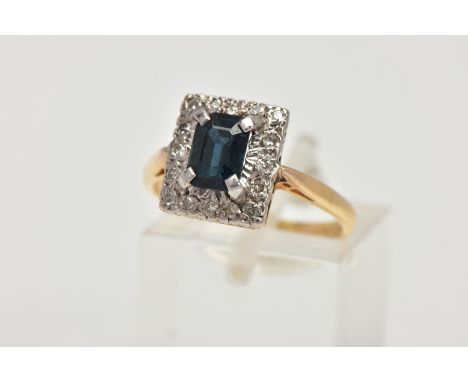 AN 18CT GOLD SAPPHIRE AND DIAMOND RING, of a rectangular form, centring on a rectangular cut blue sapphire approximate dimens