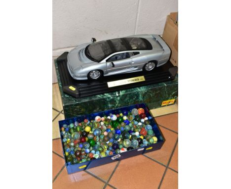 A MAISTO 1/12 SCALE DIECAST MODEL OF A JAGUAR XJ220, approximate length of car 40cm, with box and some packaging, together wi